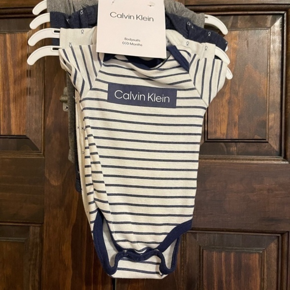My first Calvin Klein newborn bodysuit set of 4